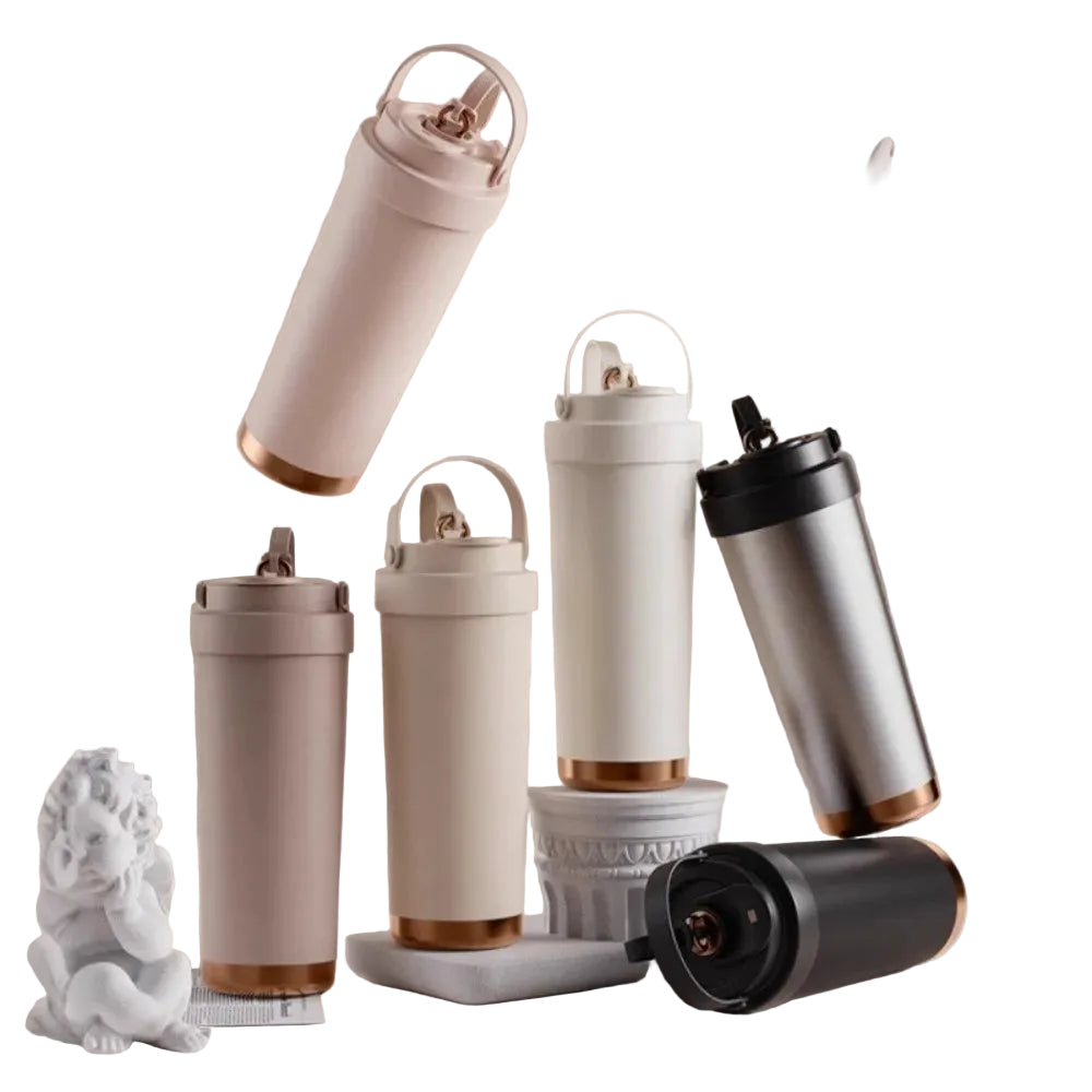 Ceramic‑coated stainless steel travel tumblers in assorted colors on decorative stands